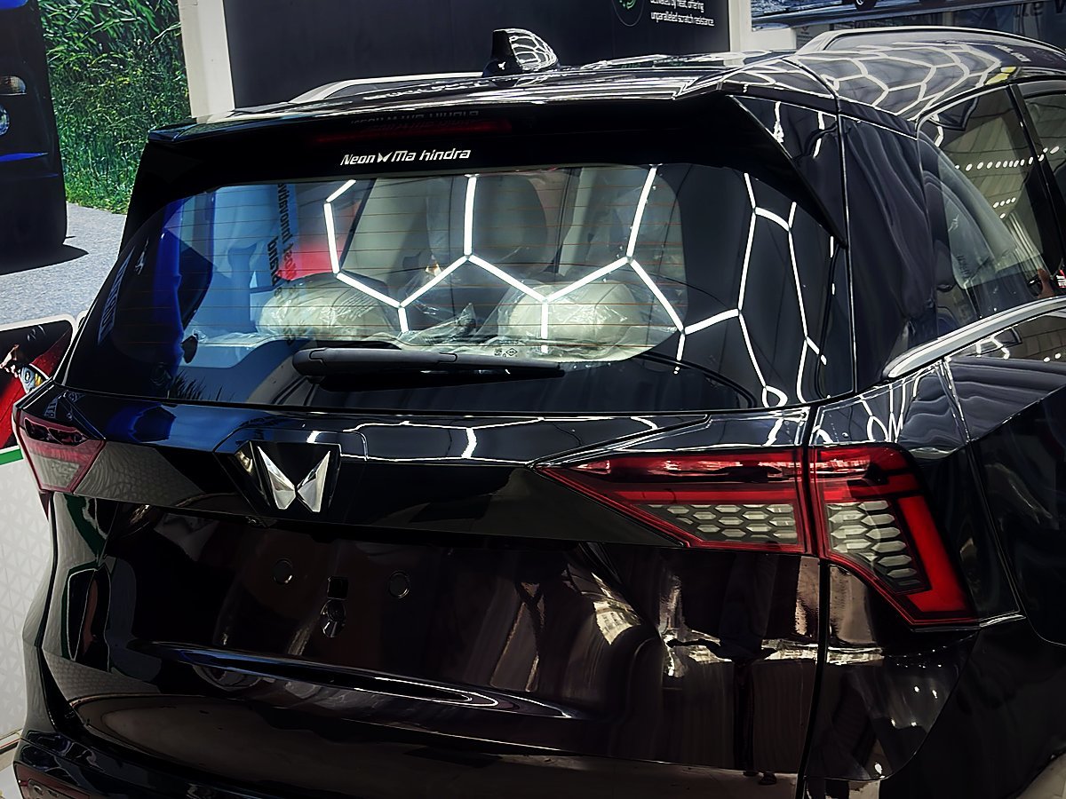 The rear of a freshly detailed black Mahindra XUV700 inside Turtle Wax Studio Tellapur