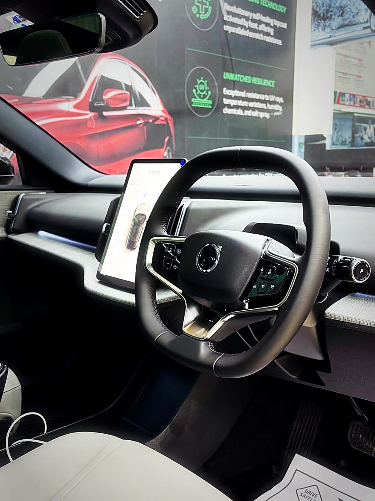 A clean modern car cabin with steering wheel and centre screen at Turtle Wax Studio Tellapur