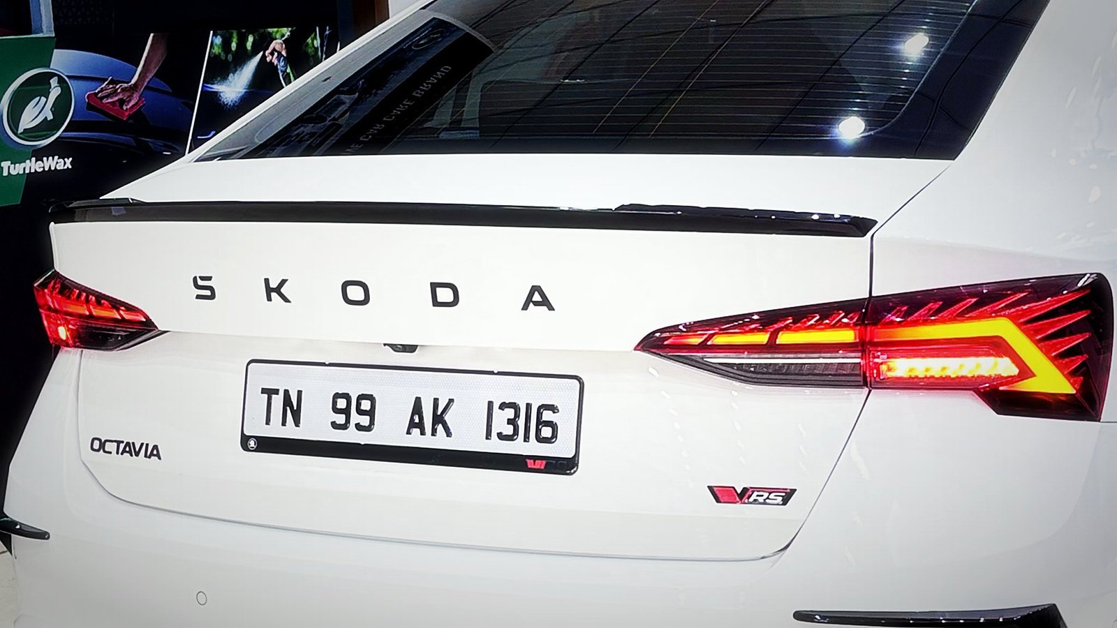 White Skoda Octavia vRS rear with tail lights lit